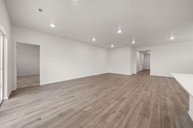 unfurnished living room with light hardwood / wood-style flooring