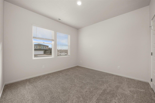 empty room featuring carpet flooring