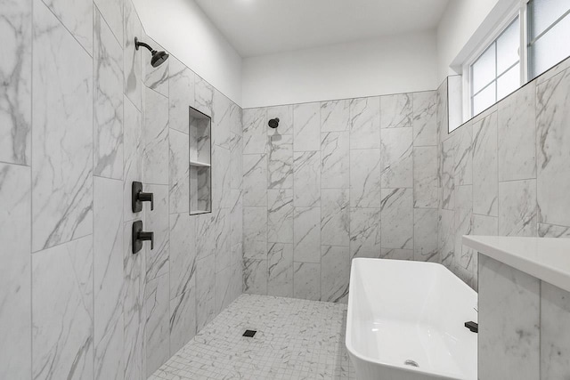 bathroom featuring separate shower and tub