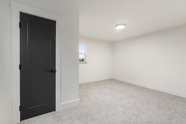 empty room with light colored carpet