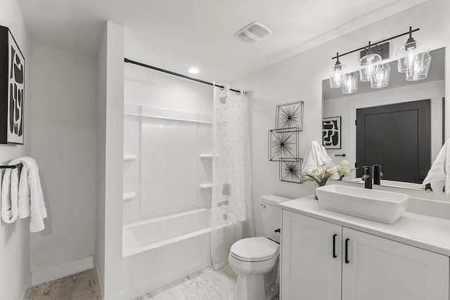 full bathroom featuring vanity, shower / bath combo, and toilet