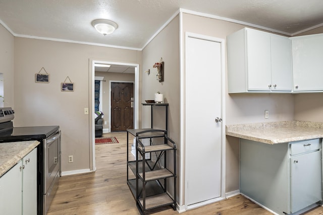 kitchen with electric range, crown molding, white cabinets, and light wood-type flooring