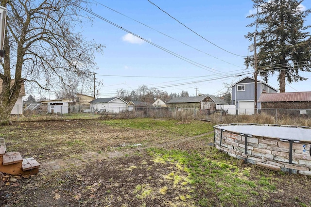 view of yard with a fenced in pool