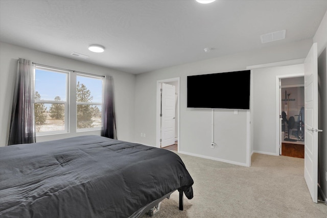 bedroom with light colored carpet