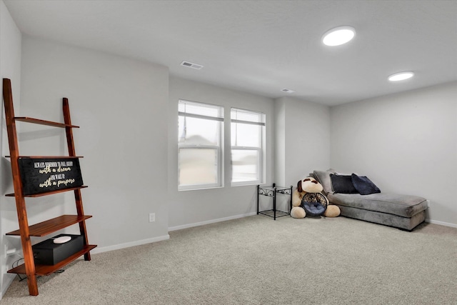 sitting room featuring carpet