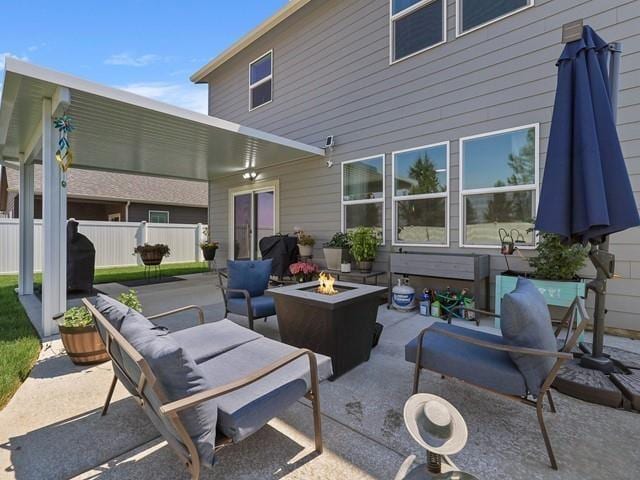 view of patio / terrace featuring an outdoor living space with a fire pit