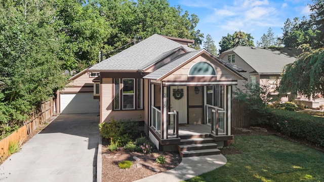 view of front of home with a garage and an outdoor structure