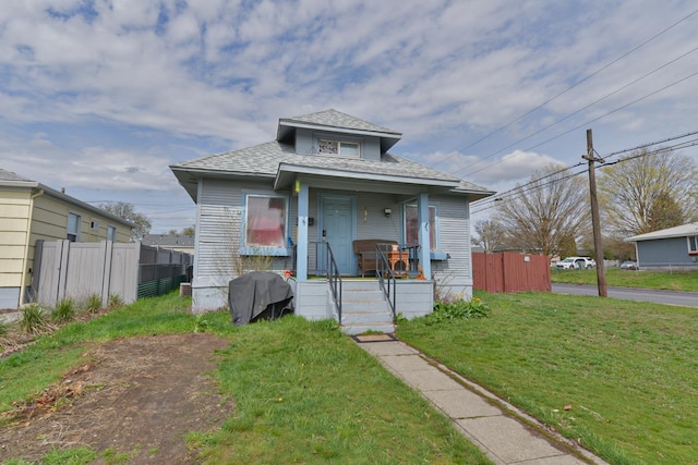 bungalow-style home featuring a front yard