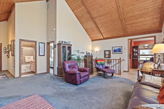 living room featuring light carpet, beamed ceiling, high vaulted ceiling, and wood ceiling