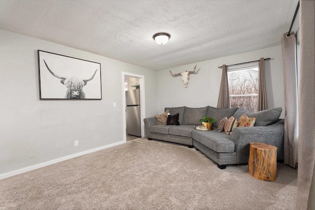 living room featuring light carpet and a textured ceiling