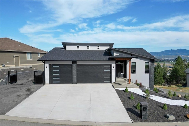 view of front of house with a mountain view and a garage