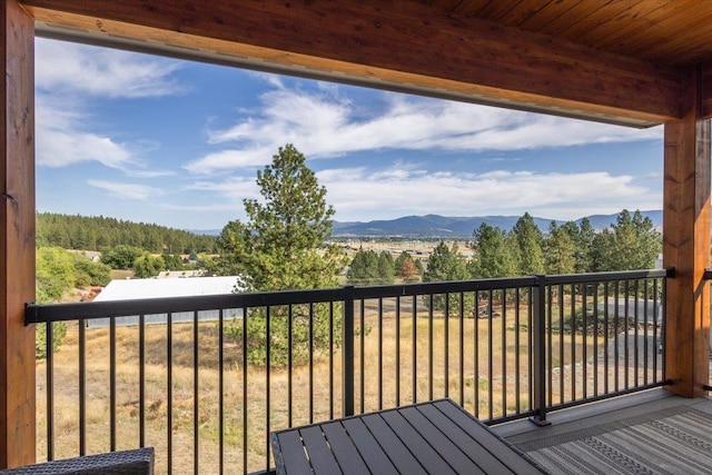 wooden terrace featuring a mountain view