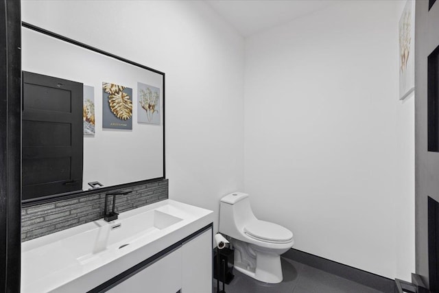 bathroom with tile patterned floors, vanity, and toilet