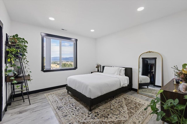 bedroom with light hardwood / wood-style flooring