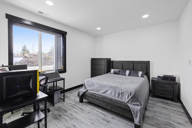 bedroom with light hardwood / wood-style flooring