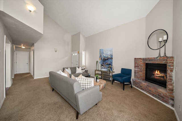 carpeted living room featuring a brick fireplace and vaulted ceiling