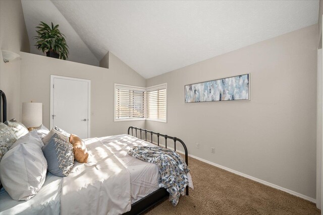 bedroom with carpet and vaulted ceiling