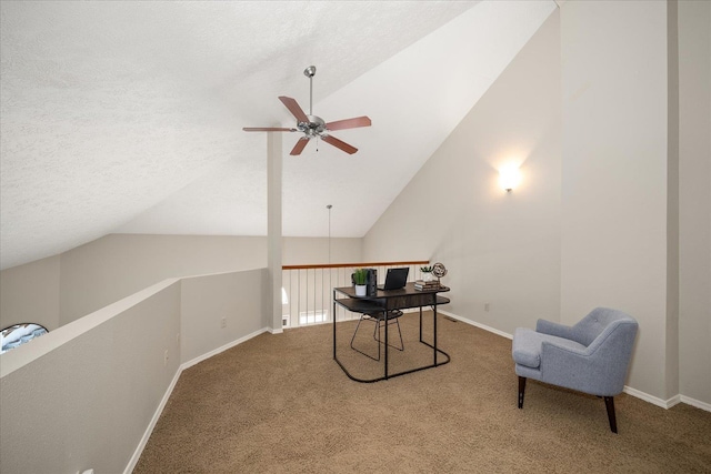 carpeted office with a textured ceiling, ceiling fan, and lofted ceiling