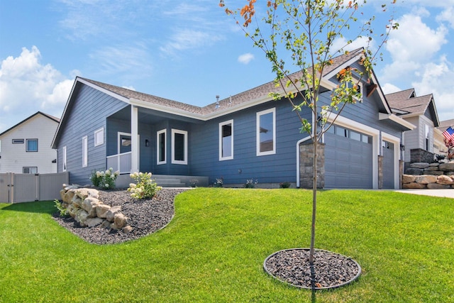 ranch-style home featuring a garage and a front lawn