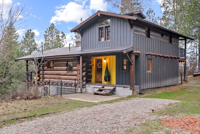 rear view of property featuring a patio area