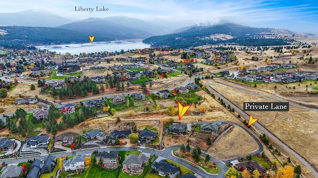 bird's eye view featuring a water and mountain view