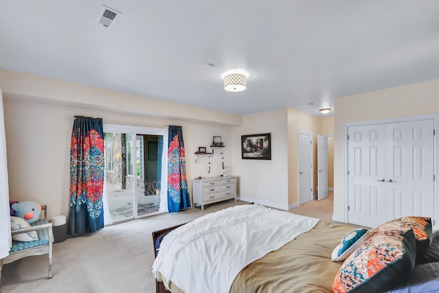 bedroom with access to exterior and light colored carpet