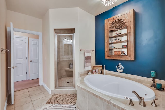 bathroom featuring tile patterned flooring and separate shower and tub