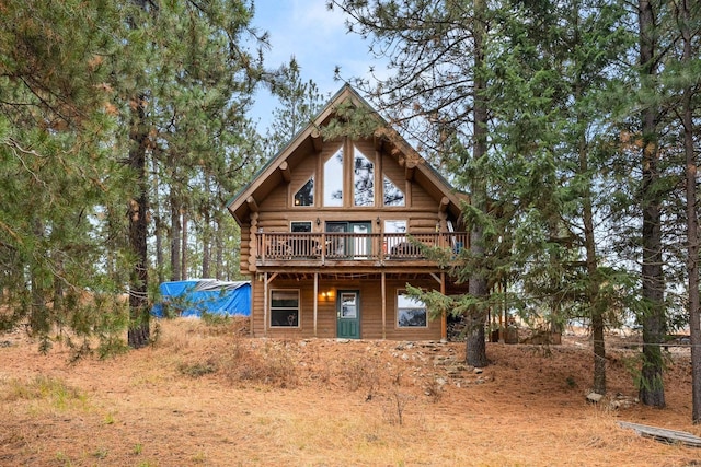 log-style house featuring a deck