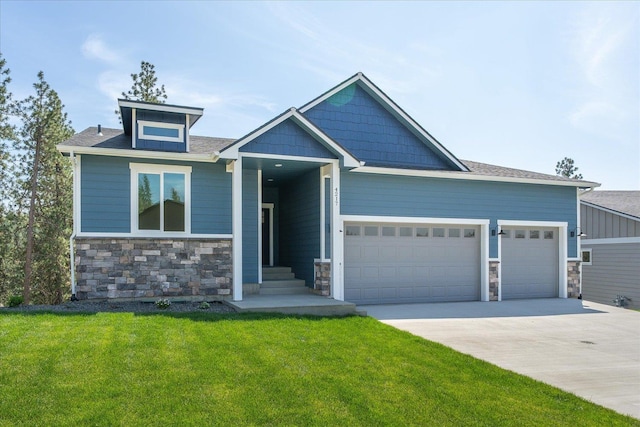4217 W Tolliver Ct, Spokane, WA 99208 - craftsman-style home featuring stone siding, a garage, and a front yard