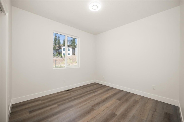 4217 W Tolliver Ct, Spokane, WA 99208 - spare room featuring dark wood finished floors and baseboards
