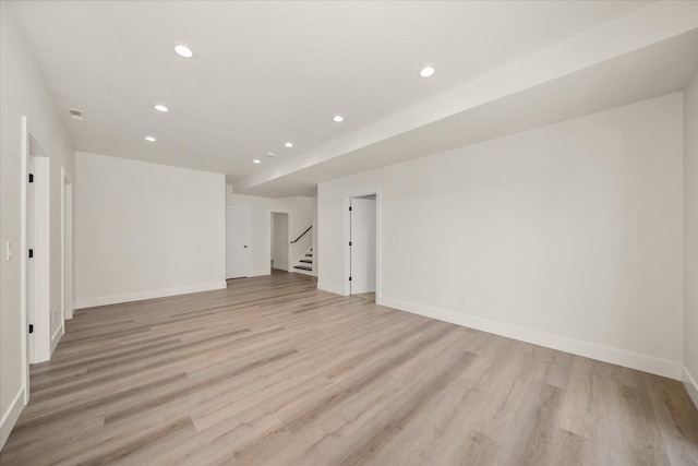 4217 W Tolliver Ct, Spokane, WA 99208 - spare room featuring recessed lighting, light wood-style flooring, and stairway