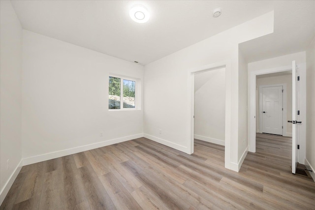 4217 W Tolliver Ct, Spokane, WA 99208 - spare room featuring light wood-style flooring and a smoke detector