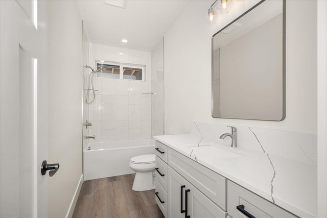 4217 W Tolliver Ct, Spokane, WA 99208 - full bath featuring vanity, wood finished floors, shower / bathtub combination, and recessed lighting