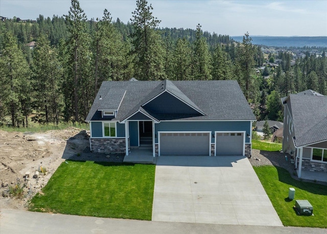 4217 W Tolliver Ct, Spokane, WA 99208 - craftsman-style house featuring a garage, stone siding, concrete driveway, and a forest view