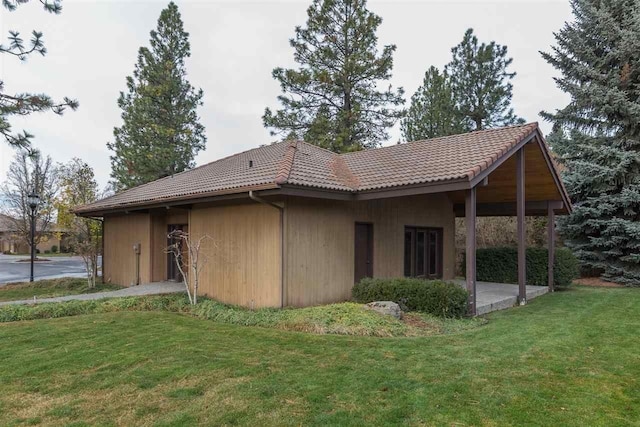 exterior space featuring a patio area and a front yard