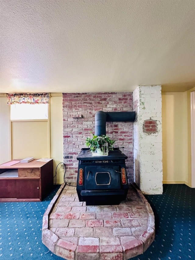 interior details featuring a textured ceiling, carpet floors, and a wood stove