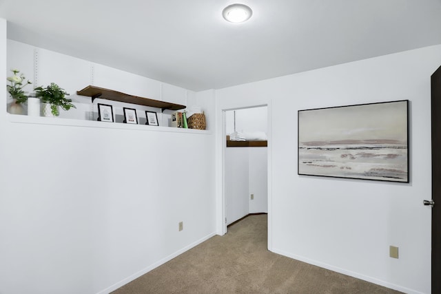 empty room featuring light colored carpet