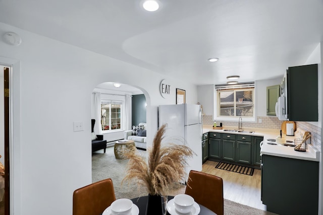 dining area featuring light hardwood / wood-style flooring and sink