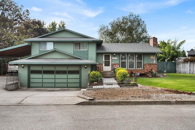 view of front of property with a carport, a garage, and a front lawn