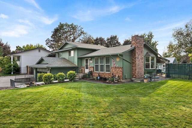 rear view of property with a yard