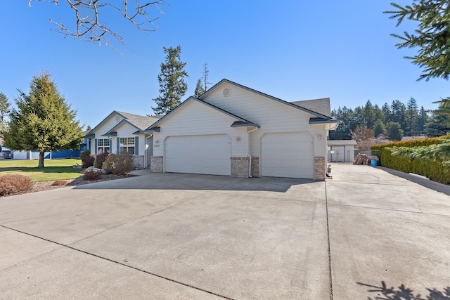 ranch-style home featuring a front yard and a garage