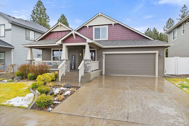 craftsman-style house with a garage and covered porch