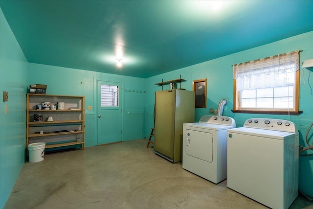 clothes washing area featuring washer and dryer