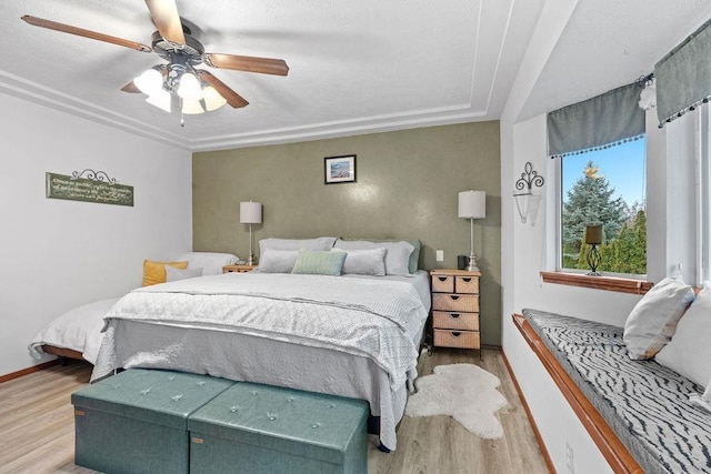 bedroom featuring ceiling fan and light hardwood / wood-style floors