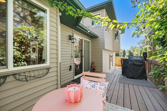 wooden terrace featuring area for grilling