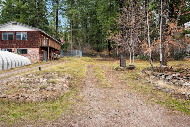 view of yard featuring a wooden deck