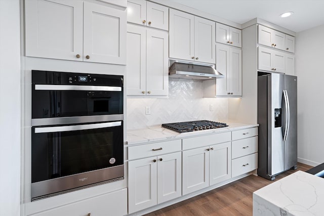 4706 W Lex Ave Lot 5, Spokane, WA 99208 - kitchen featuring appliances with stainless steel finishes, under cabinet range hood, white cabinets, dark wood finished floors, and recessed lighting