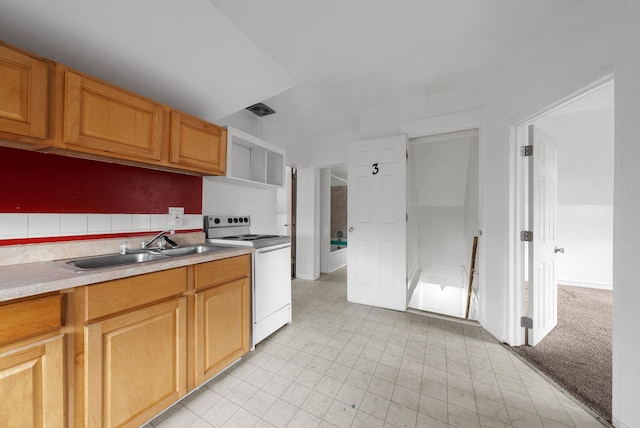 kitchen with pendant lighting, white range with electric stovetop, sink, and light carpet