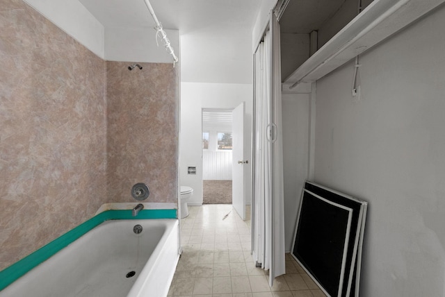 bathroom with a bathing tub and toilet