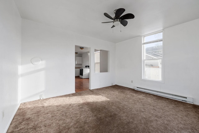 empty room with ceiling fan, dark carpet, and a baseboard heating unit